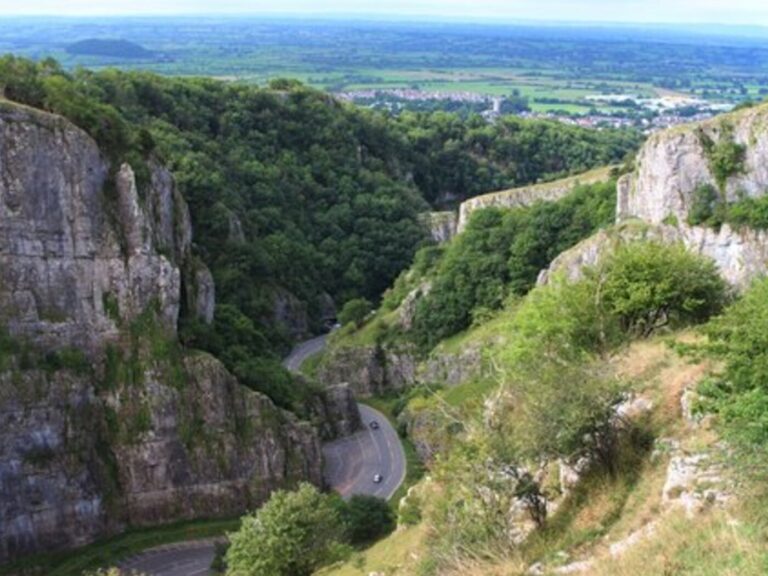 Limestone cliffs of Cheddar Gorge looking out over the Somerset Levels