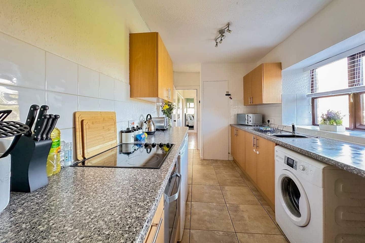 Fully equipped kitchen with washing machine at Farm Cottage, Kewstoke