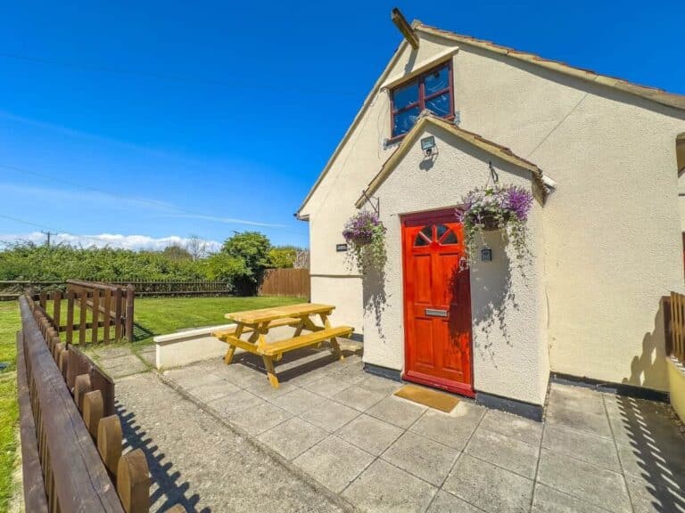 Farm Cottage front door and patio – request early check-in and other add-ons for your stay