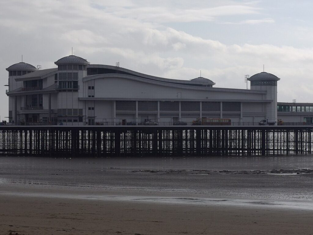 The Grand Pier at Weston-super-Mare seen from the beach at low tide
