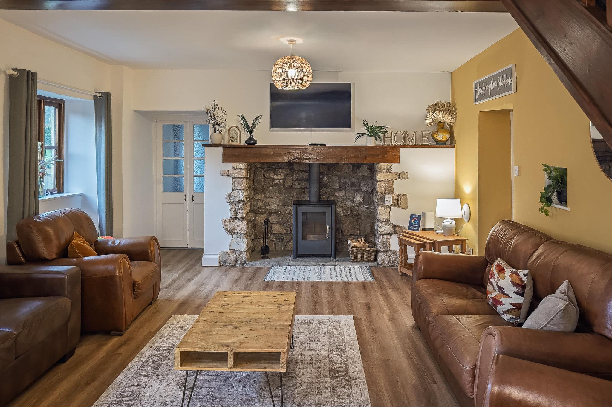 Monthly stays in Weston-super-Mare: the living room with log burner at Inglenook Cottage