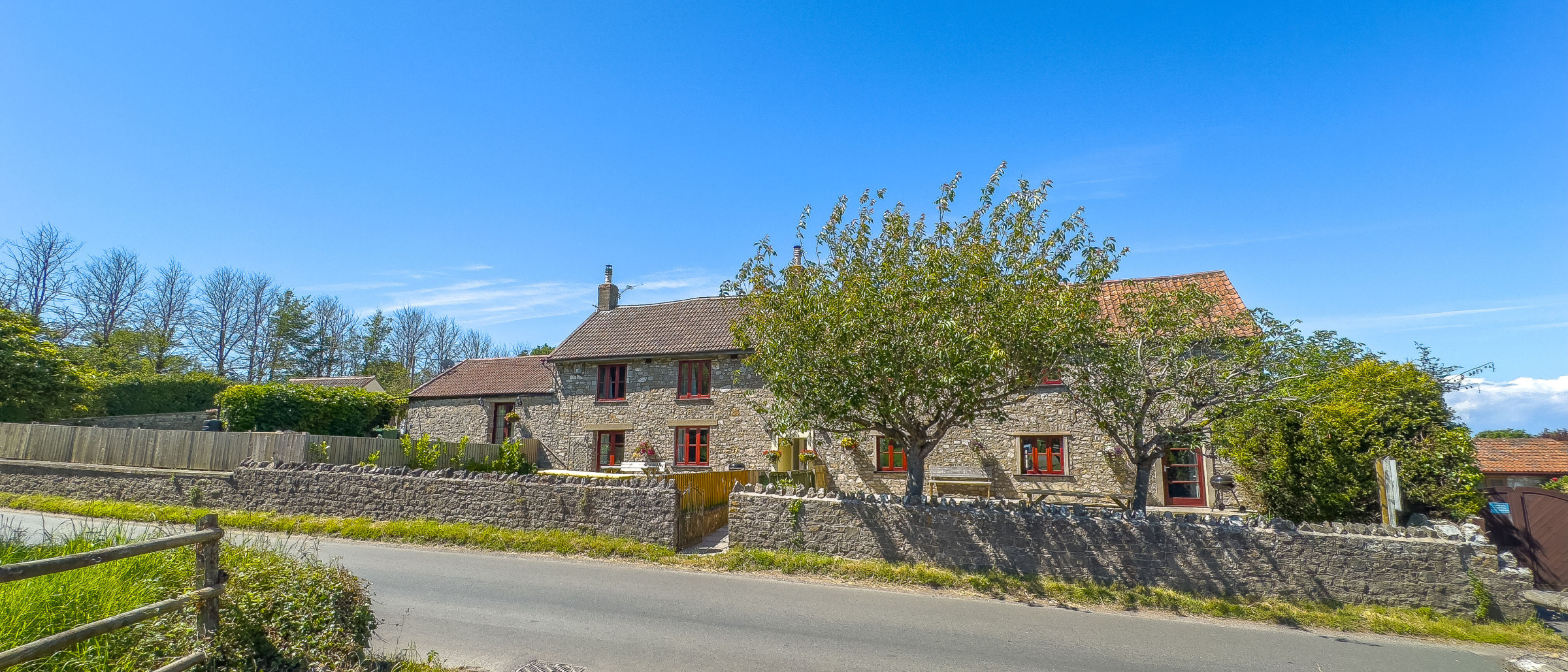 Norton Court Farm stone farmhouse seen from Lower Norton Lane, Kewstoke