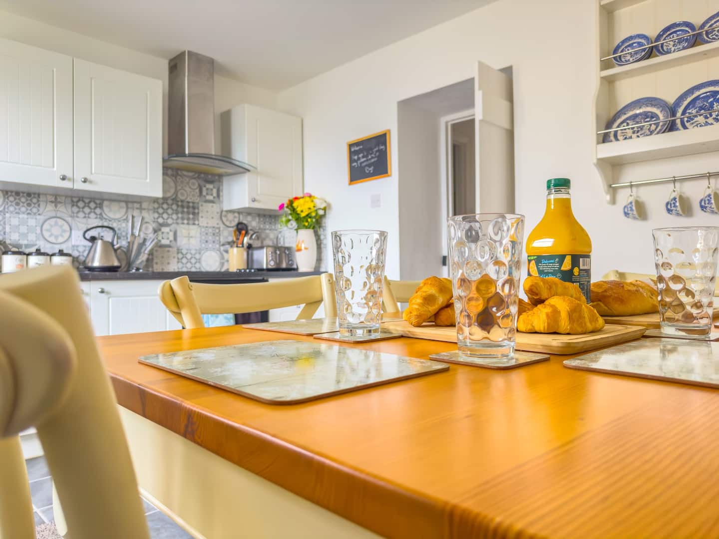 Dining table laid for breakfast at Norton Court Cottage